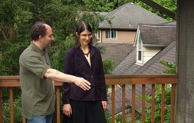 Tim McGill discussing a home inspection on a deck